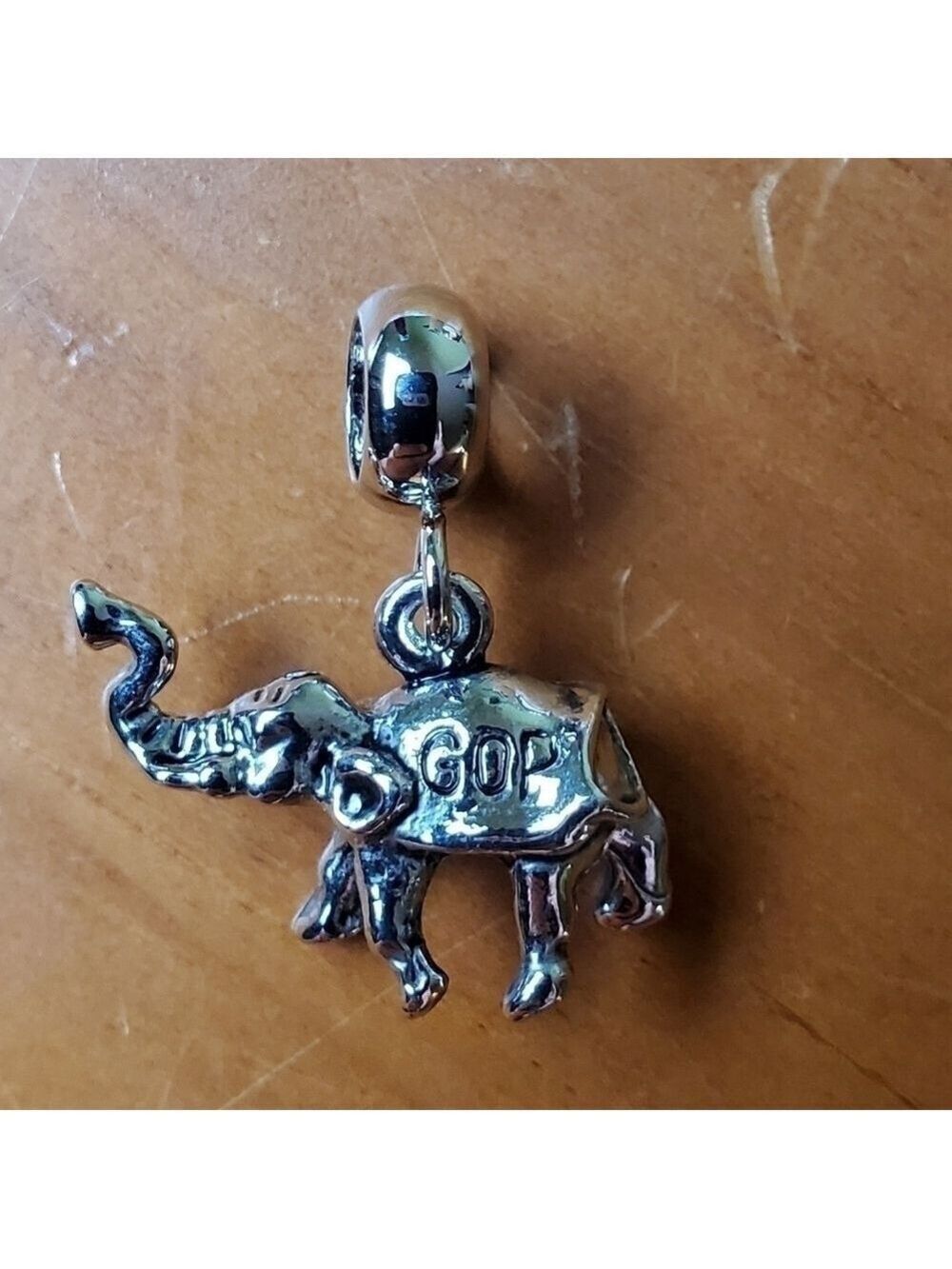 NWOT charm, silver colored elephant with GOP on each side